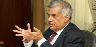 Ranil calls for postponement of elections