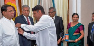 The first flag of National Housing Day Flags Week pinned on the President