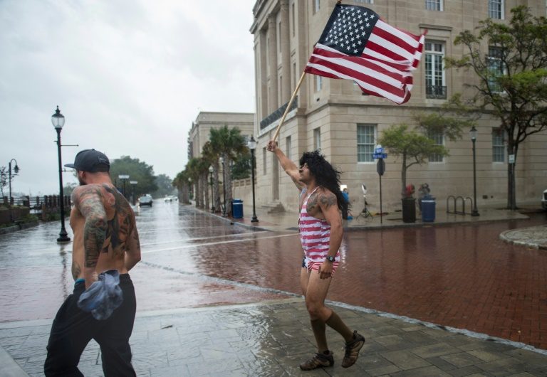‘Once in a lifetime’ hurricane weakens, begins lashing eastern US