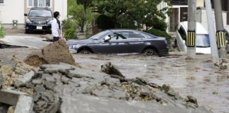 Dozens missing after strong Japan earthquake and mudslides