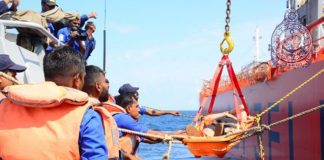 Navy renders assistance to transfer a mariner ashore for treatment
