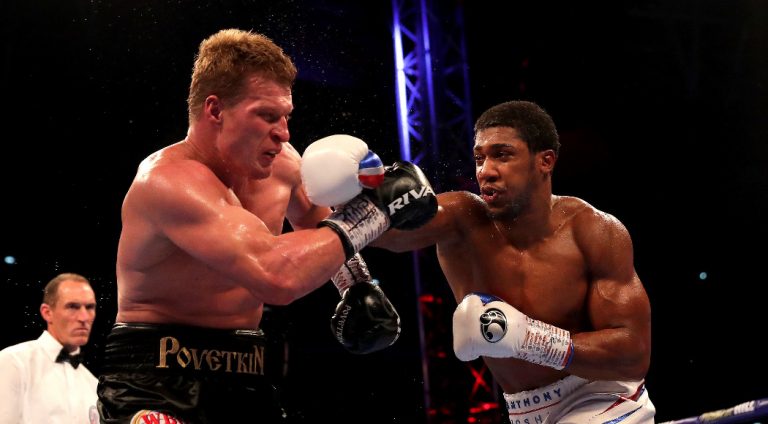 Joshua overpowers Povetkin to retain world heavyweight titles