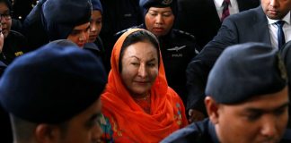 Wife of ex-Malaysian leader charged with money laundering