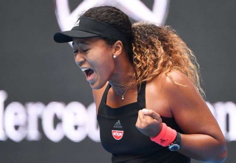 Tearful Osaka survives huge scare to reach Beijing semis