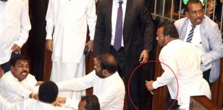 Complaint against Thewarapperuma for brandishing knife inside House