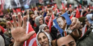 Turks vote in test for Erdogan as recession hits home