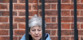 Besieged May pleads with EU to help save her Brexit plan