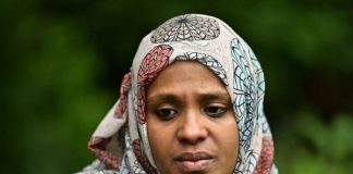 A squeezed hand offers glimmer of hope after New Zealand massacre