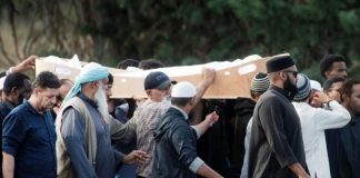 New Zealand burials start as PM urges ‘united front’ on social media
