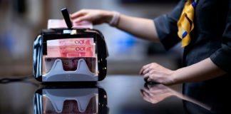 China further weakens yuan rate as currency row simmers