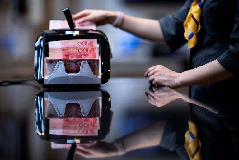 China further weakens yuan rate as currency row simmers