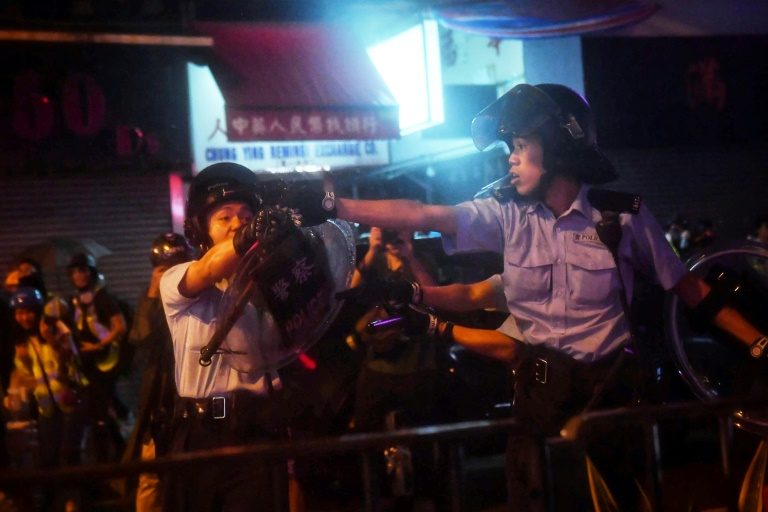 HK police say violent protesters forced use of water cannon, warning shot