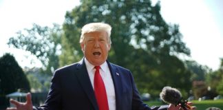 Trump denies stoking extremism on visit to massacre sites