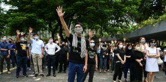 Thousands march as Hong Kong government mulls face mask ban