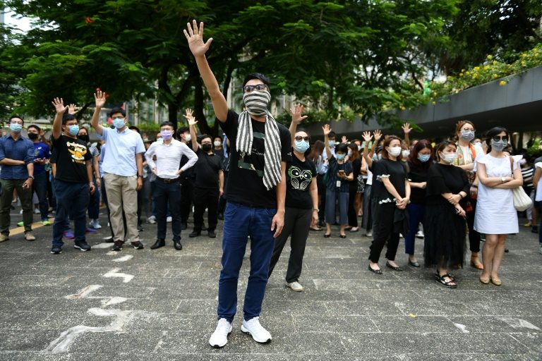 Thousands march as Hong Kong government mulls face mask ban