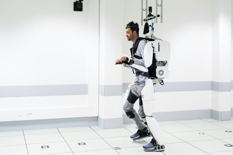 Paralysed man walks again with brain-controlled exoskeleton