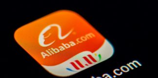 Alibaba shares surge almost 8% on Hong Kong debut