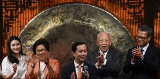 Alibaba shares surge on Hong Kong debut