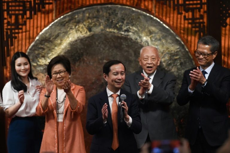 Alibaba shares surge on Hong Kong debut
