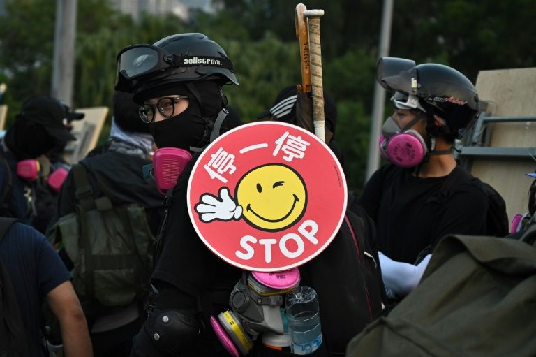 Hong Kong protesters fire arrows at cops and choke city for fourth day