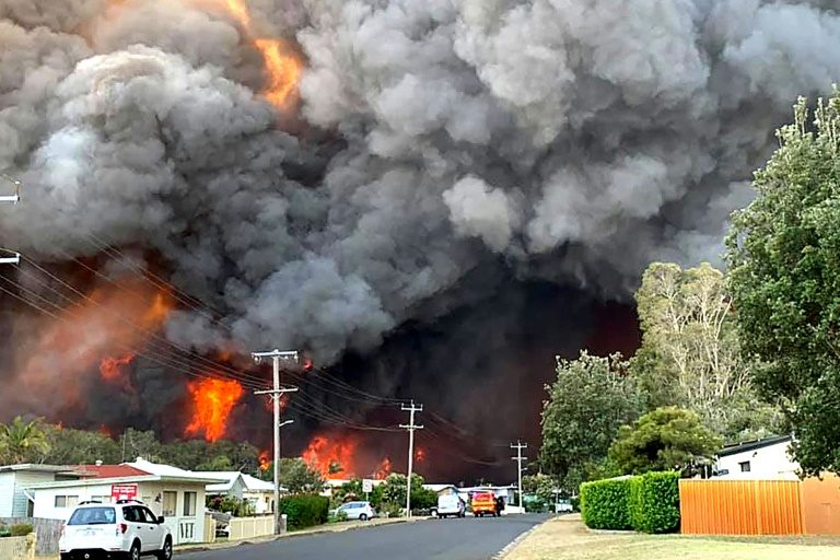 Two dead, at least 100 homes lost in Australia bushfires