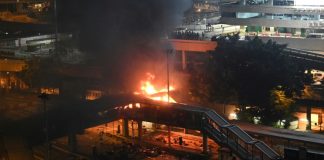 Protesters set fire to hold off police at Hong Kong campus