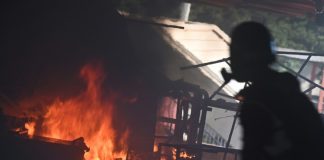 Police shoot protester, man set alight in day of Hong Kong fury