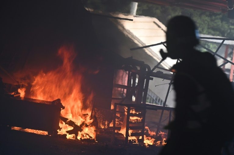 Police shoot protester, man set alight in day of Hong Kong fury