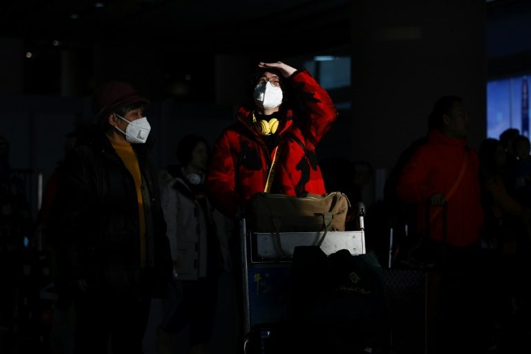 China says virus spreading between humans as WHO set to meet