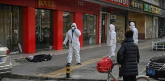 US warns against China travel, as virus death toll hits 213
