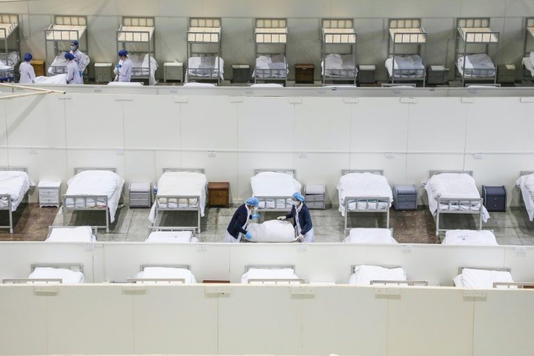 China scrambles to find beds for virus patients as deaths hit 563
