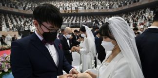 In sickness and in health: mass wedding defies virus fears