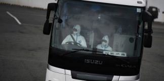Japan lets some passengers leave ship for quarantine on land