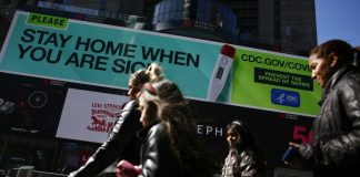 Asian markets sink as pandemic deaths soar