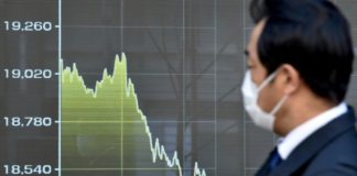 Global banks take crisis measures as virus death toll surges