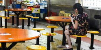 In virus fight, Singapore may jail people who stand close