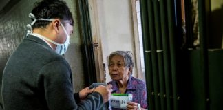 Hong Kong political rivals woo voters with free face masks