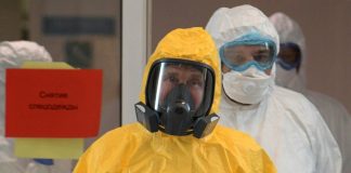 Putin delays reforms vote, holds back on tough virus measures