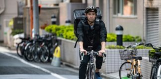 From medals to pedals: Japan Olympic fencer turns to food delivery