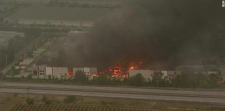 Fire tears through Amazon distribution center in Redlands, California
