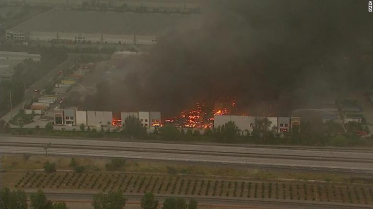 Fire tears through Amazon distribution center in Redlands, California