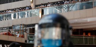 Beijing’s Hong Kong office warns pro-democracy poll could violate new security law