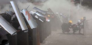 Myanmar forces fire tear gas, stun grenades on protest as UN envoy calls for action